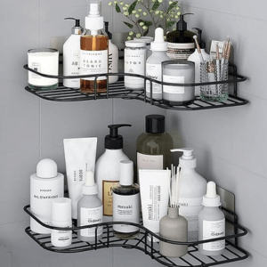 Black metal corner bathroom shelves with suction cups holding skincare products and toiletries