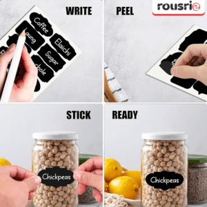 Hands applying reusable chalkboard labels to glass jars for kitchen organization
